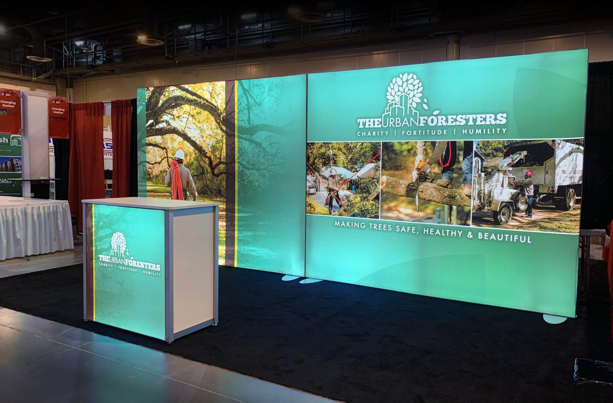 Cyan, back-lit exhibit reinforces the Urban Foresters brand with a matching back-lit counter, podium, and photography.