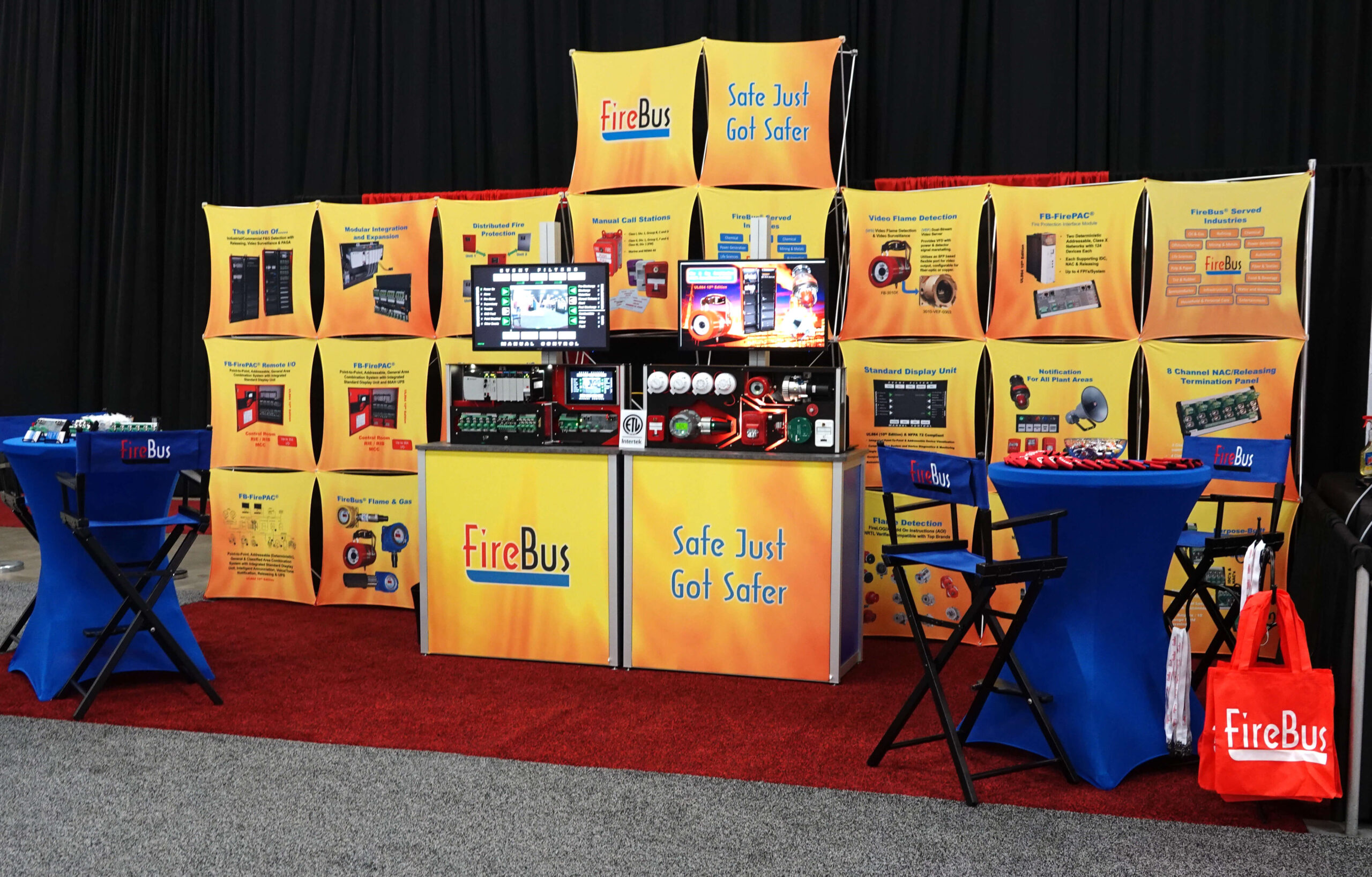 Yellow, Firebus-branded, custom backlit counters with Exhibit Network graphic design and special assembly for two monitors.