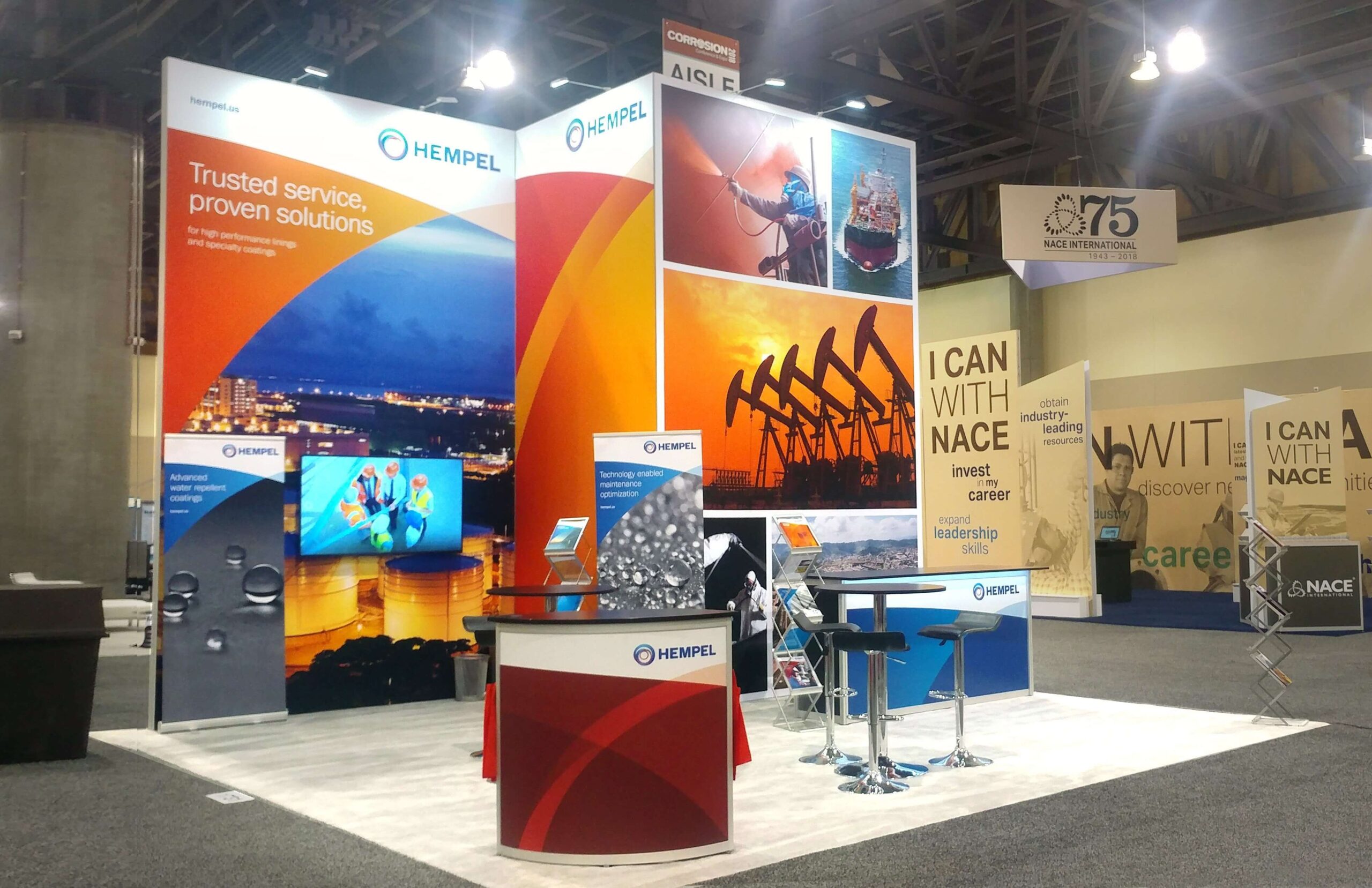 Exhibit with fabric graphic panels and lightweight custom counter to lower shipping, material handling and installation costs