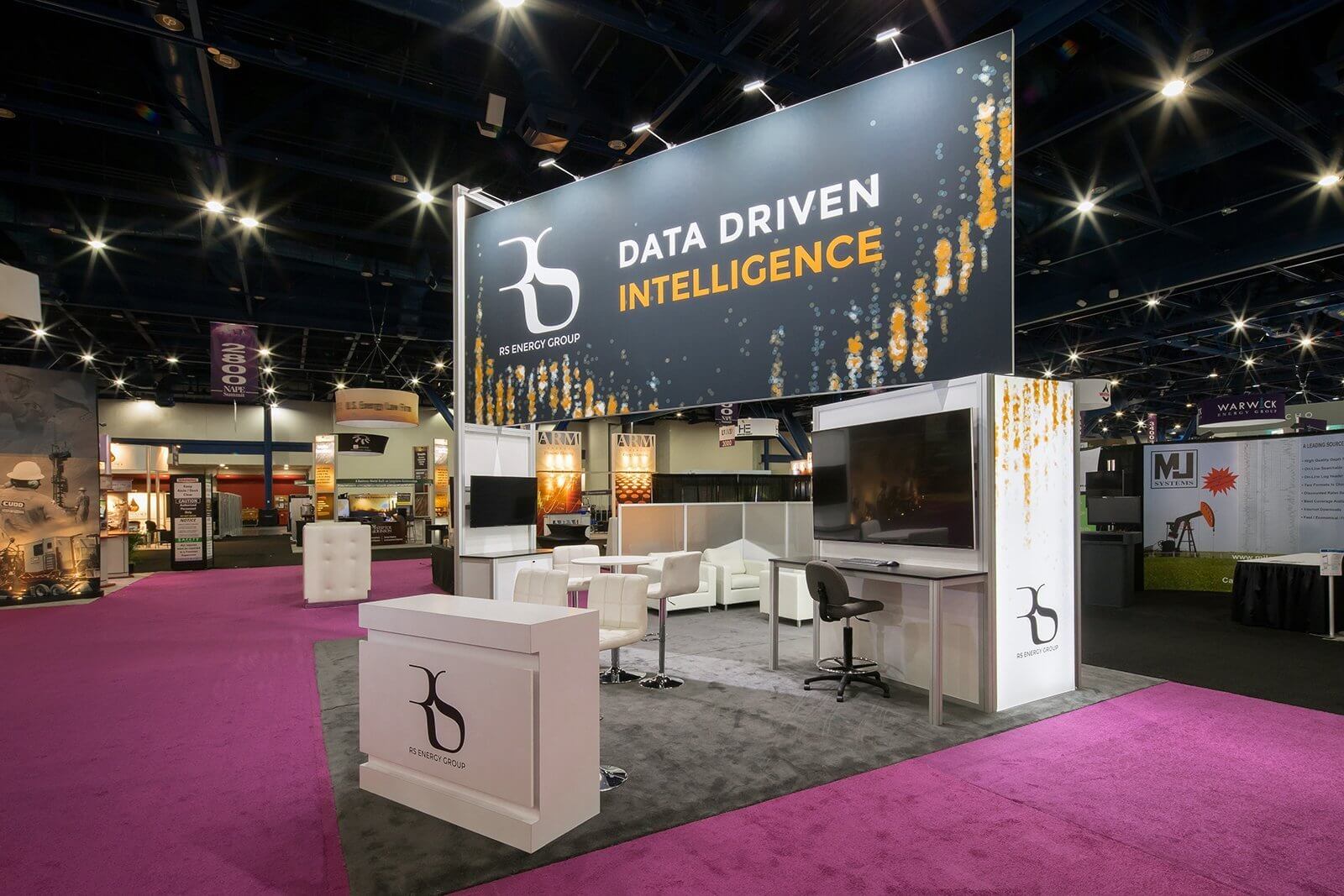 Flexible exhibit with a 20’ graphic and two backlit sidewall closets is designed and engineered for multiple configurations.