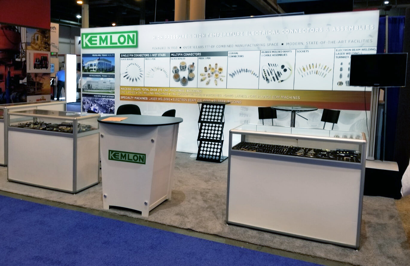10 x 20 rental booth with counter, seating,  product photography, product display cases, and back lit fabric graphic for OTC