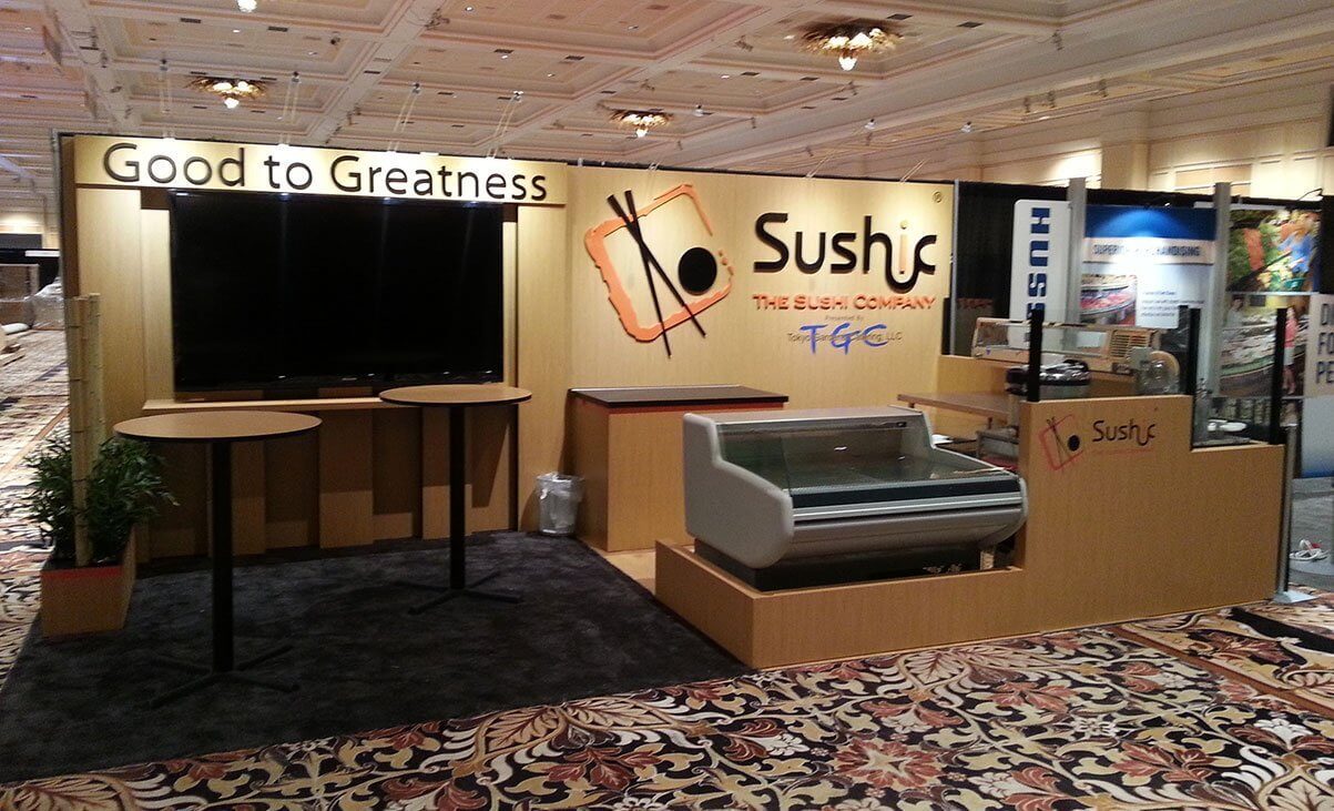 Restaurant in exhibitor booth with prep area, refrigerator, chest freezer, working sink, wash station, self-service display
