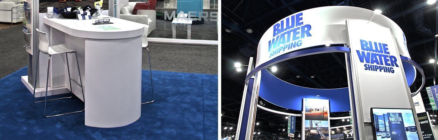Blue Water Shipping white trade show podium and branded circular exhibit tower with video monitors and overhead lighting.