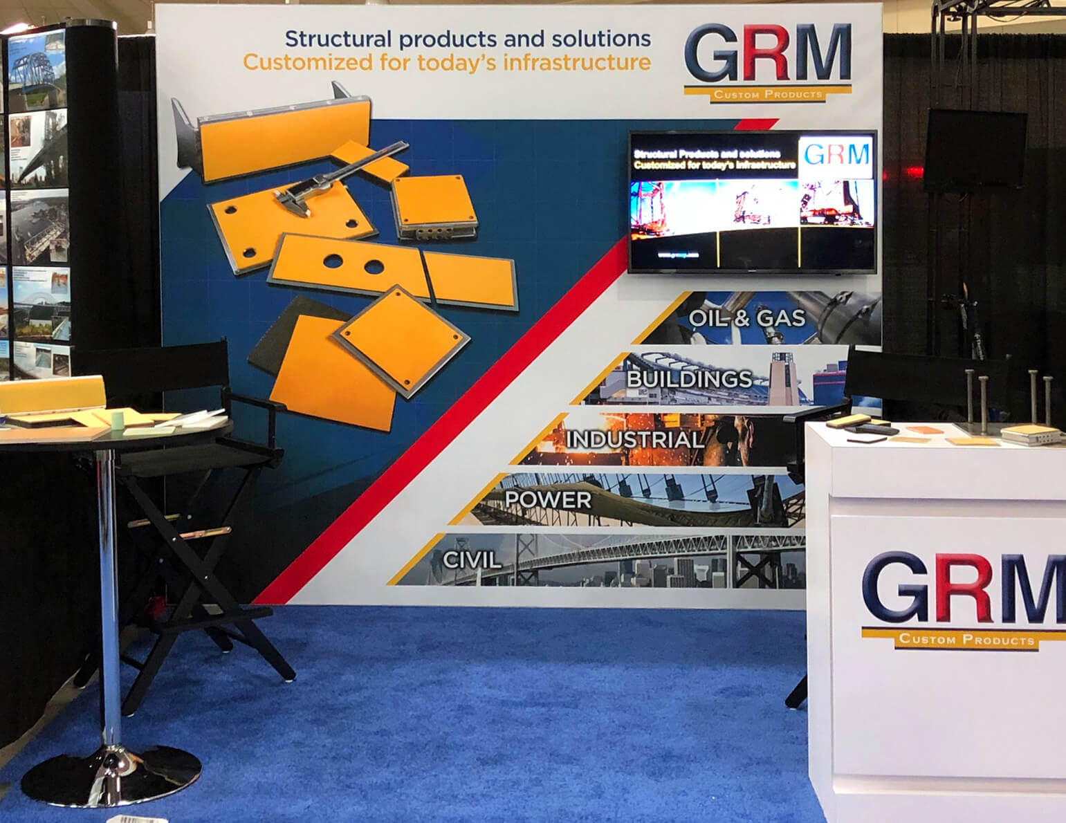 10’ display with back wall exhibit, fabric graphic, floating monitor mount, lockable greeting counter, and 30” bistro table.